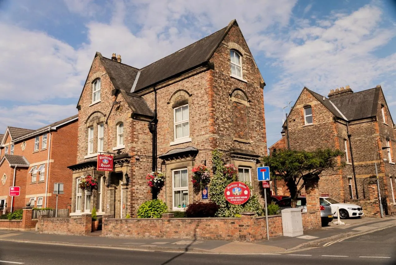 an old brick building on a city street at Barbican House in York
