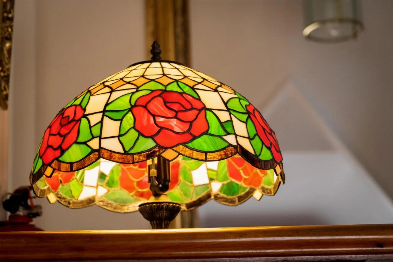 a stained glass chandelier in front of a mirror at Barbican House in York